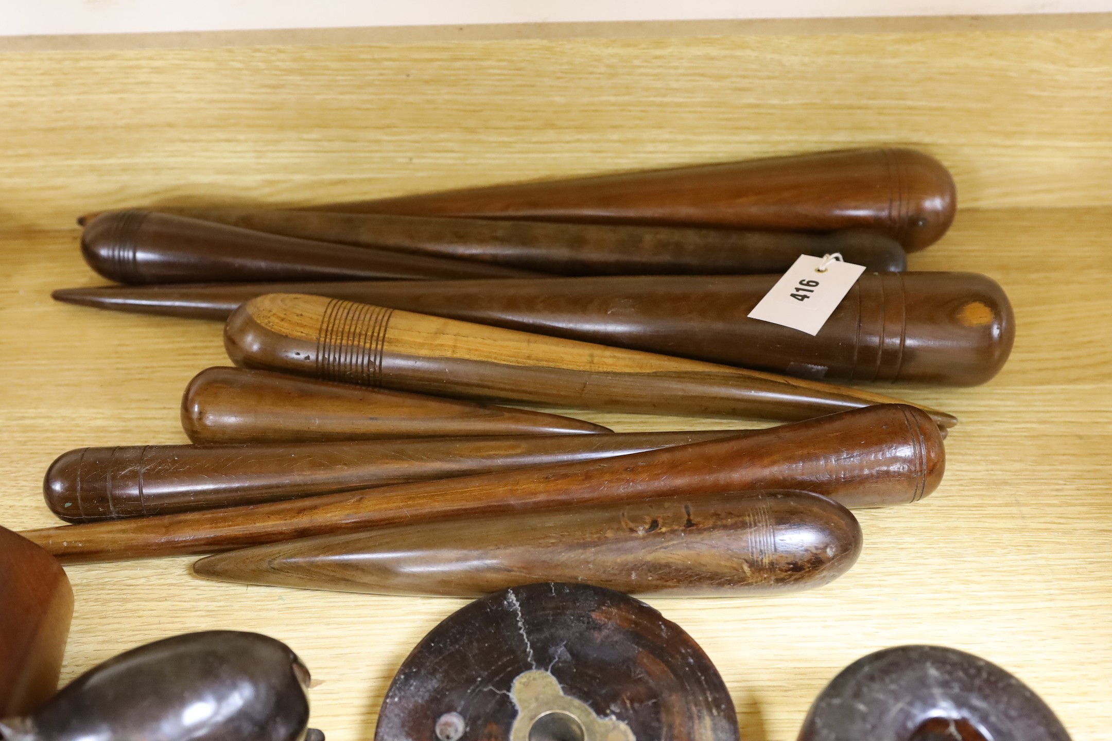 A collection of lignum vitae, rosewood etc. fids, pulley wheels etc